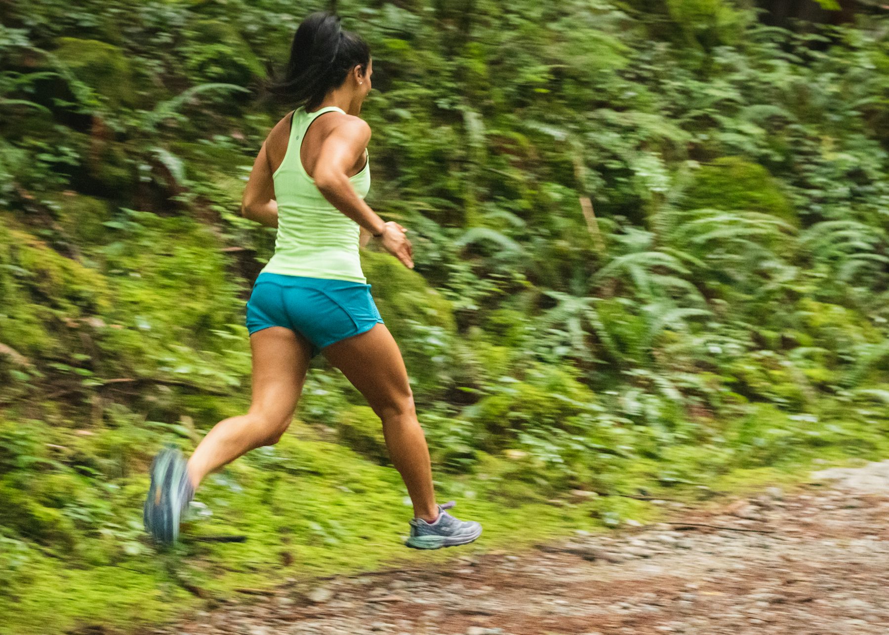 A woman running on a trail